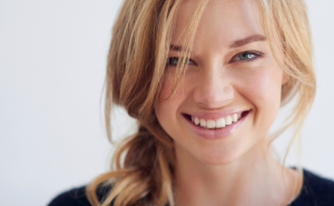 A blonde hair woman smiling at the camera with facial aesthetics, Roseacre Dental Practice - Dentist in Maidstone, Kent