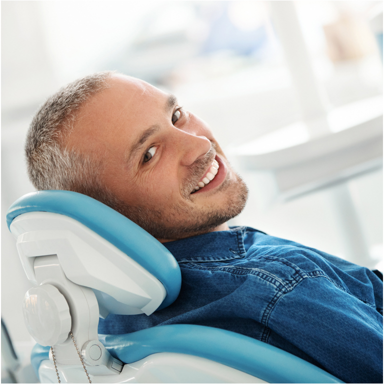 Man in dental chair at dental practice in Maidstone, Kent