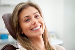 Woman with bite problems sat in dentist chair