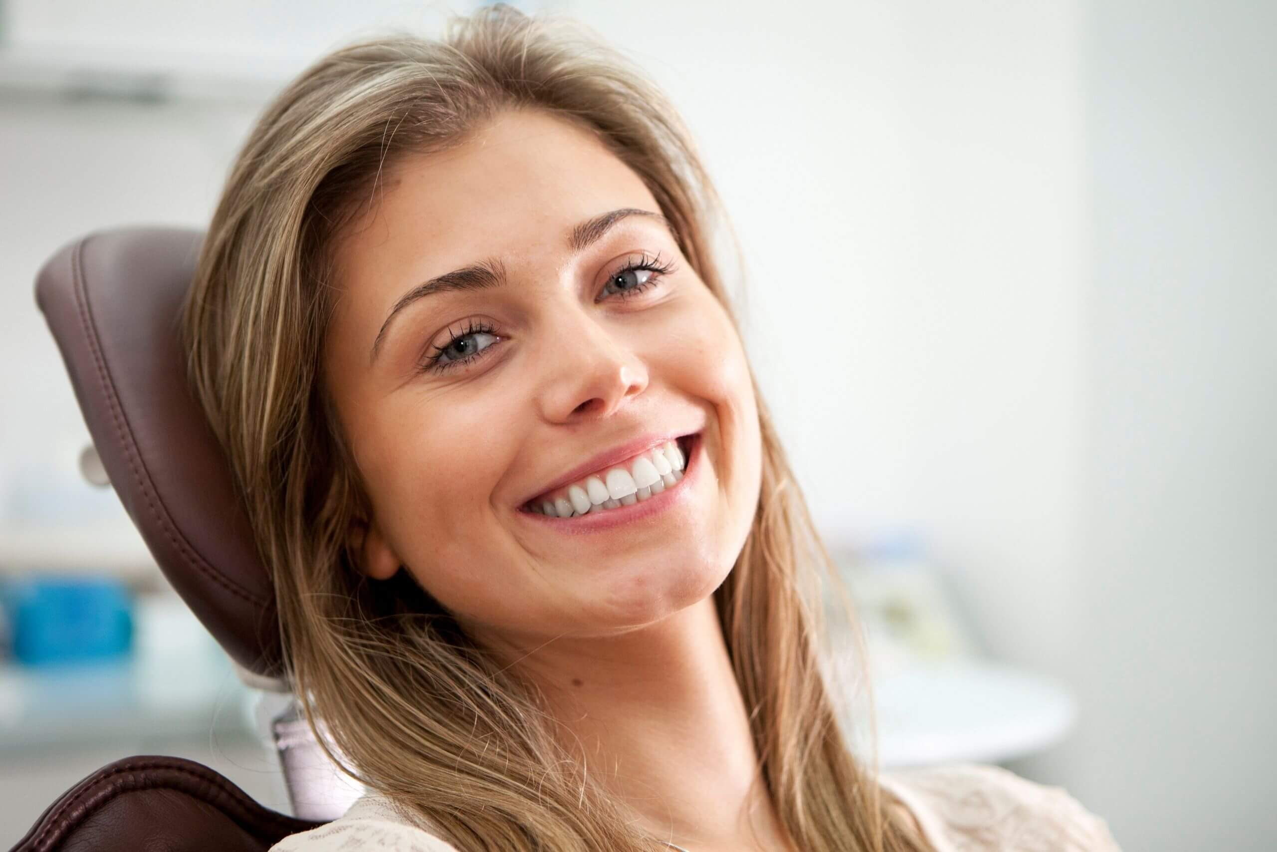 Woman with bite problems sat in dentist chair