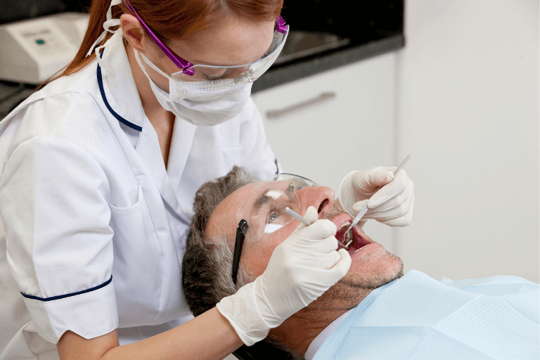 a man receiving a dental check up on his gum recession