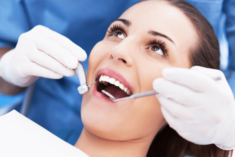 Brunette woman with good dental health at dental hygienist in Maidstone
