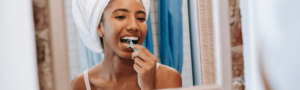 Woman flossing her teeth