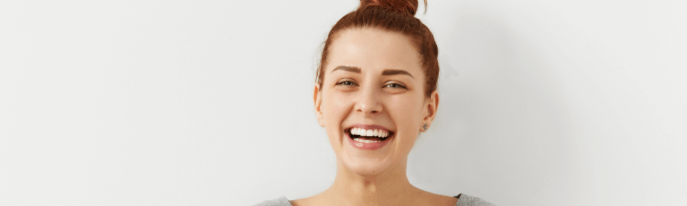 woman smiling after metal braces in maidstone, kent