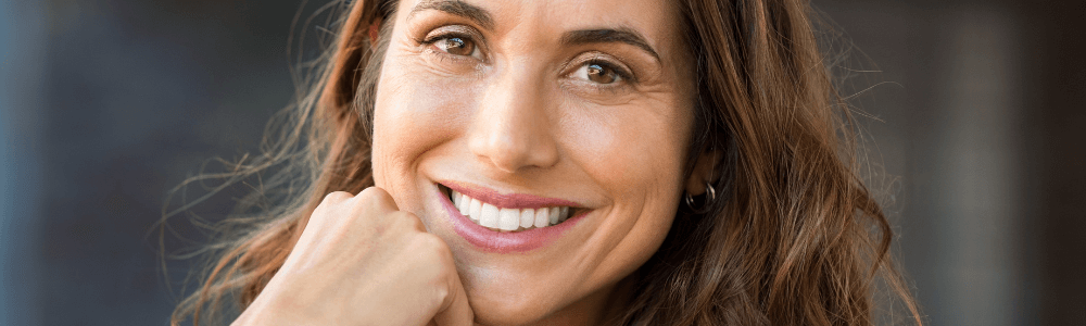 woman with dental implants in maidstone, kent smiling