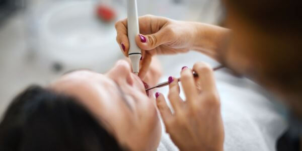 Woman during dental hygienist appointment at Maidstone dental practice