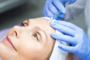 woman having treatment to remove frown lines
