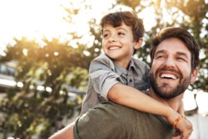 father and son smiling and laughing after a roseacre dental appointment