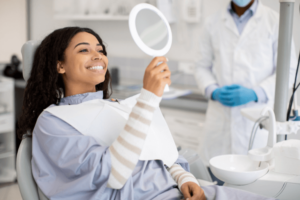 client in a dental chair after a dental hygiene appointment